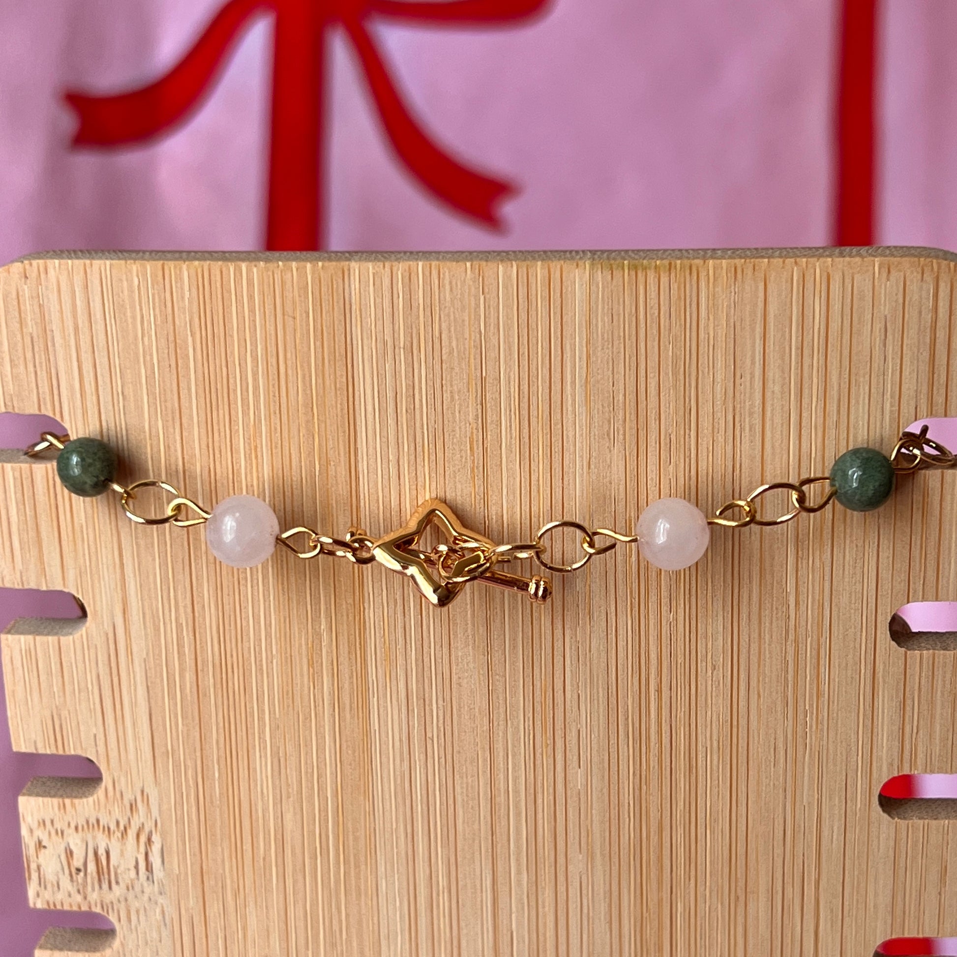 Fairycore crystal portrait necklace — 20" beaded necklace with rose quartz, Indian agate, and upcycled rutilated quartz plus handmade iridescent bedazzled portrait charm. 18k gold plated findings + 18k gold filled jump rings; ornate toggle clasp. Gift-ready green Victorian-style box; ready to ship.