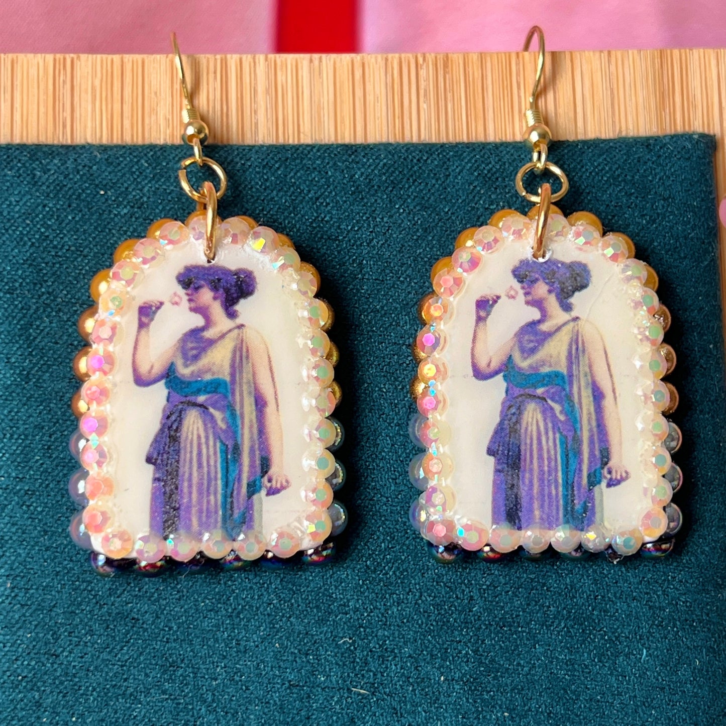 Antique-inspired “Fragrant Rose” earrings featuring handmade polymer‑clay oil‑painting charms bedazzled with a gradient of iridescent pearls and rhinestones, gold‑plated hypoallergenic hooks, and a romantic, vintage‑vibe perfect for coquette, alt‑romantic and vintage‑inspired jewelry lovers.