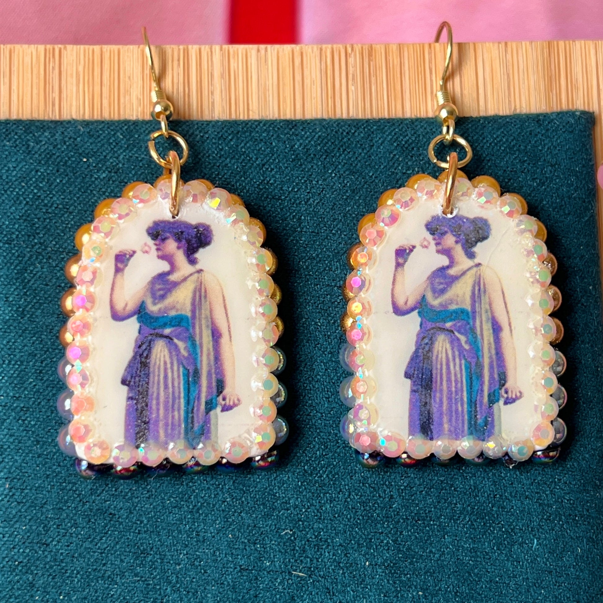 Antique-inspired “Fragrant Rose” earrings featuring handmade polymer‑clay oil‑painting charms bedazzled with a gradient of iridescent pearls and rhinestones, gold‑plated hypoallergenic hooks, and a romantic, vintage‑vibe perfect for coquette, alt‑romantic and vintage‑inspired jewelry lovers.