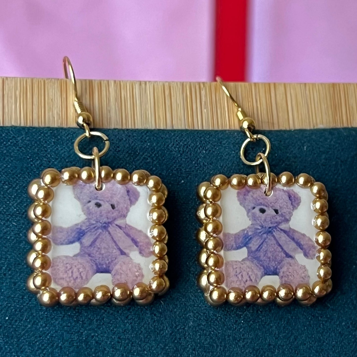 Gold pearl-framed teddy bear earrings, nostalgic toycore/coquette jewelry with a vintage plushie bear, 18k gold-plated hooks, handmade polymer clay charm, golden bronze faux pearls, kidcore style, statement ear dangles, collectible and gift‑ready.
