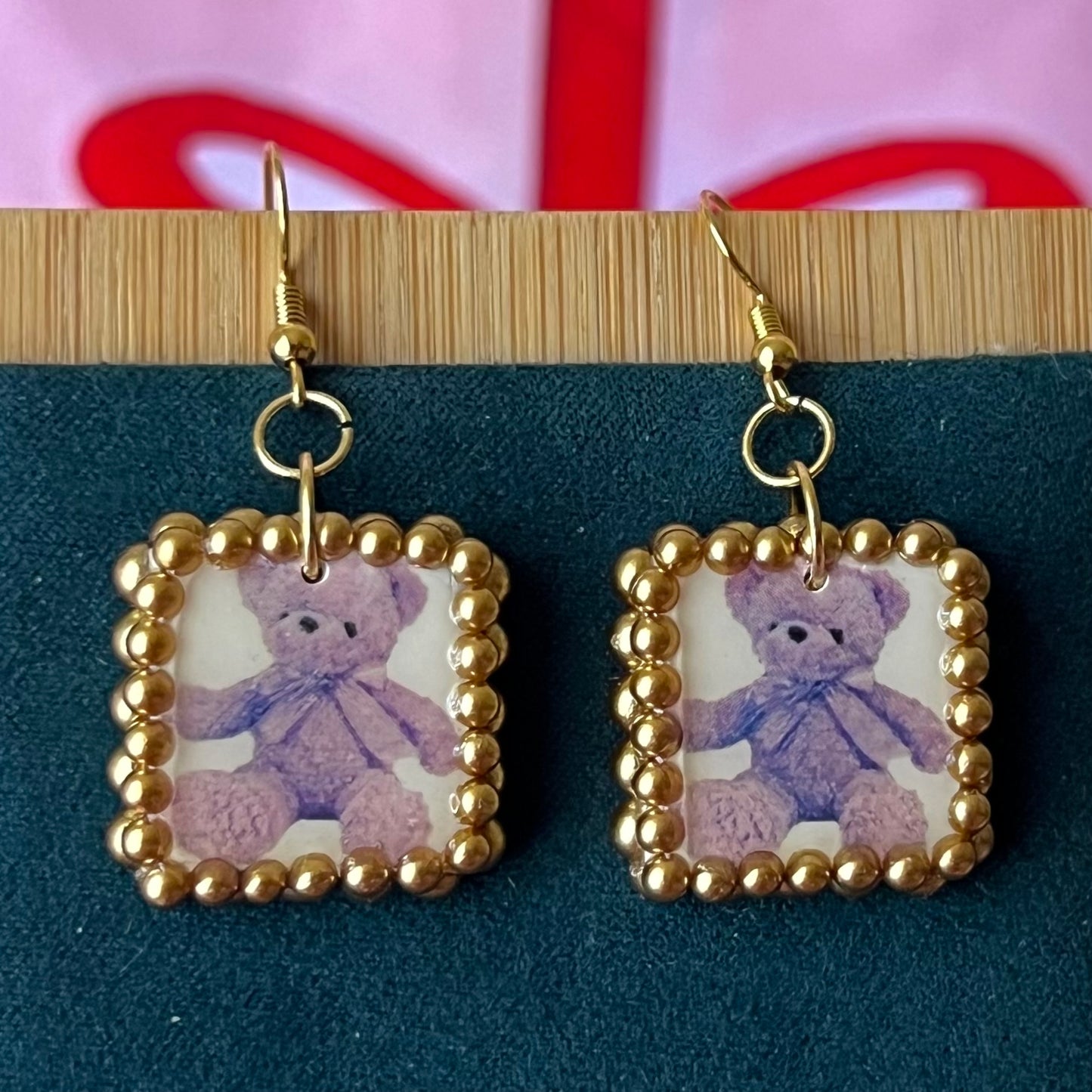 Gold pearl-framed teddy bear earrings, nostalgic toycore/coquette jewelry with a vintage plushie bear, 18k gold-plated hooks, handmade polymer clay charm, golden bronze faux pearls, kidcore style, statement ear dangles, collectible and gift‑ready.
