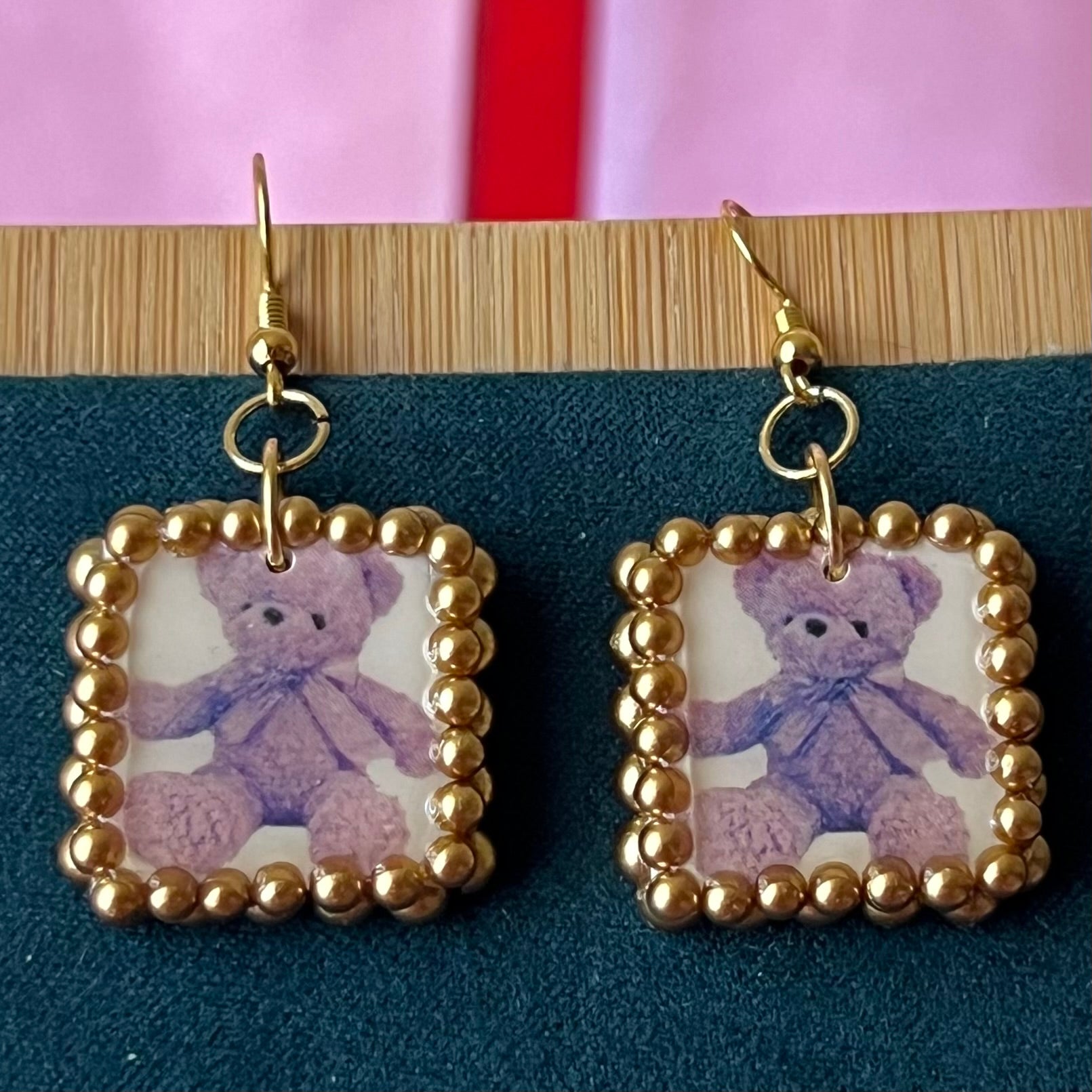 Gold pearl-framed teddy bear earrings, nostalgic toycore/coquette jewelry with a vintage plushie bear, 18k gold-plated hooks, handmade polymer clay charm, golden bronze faux pearls, kidcore style, statement ear dangles, collectible and gift‑ready.