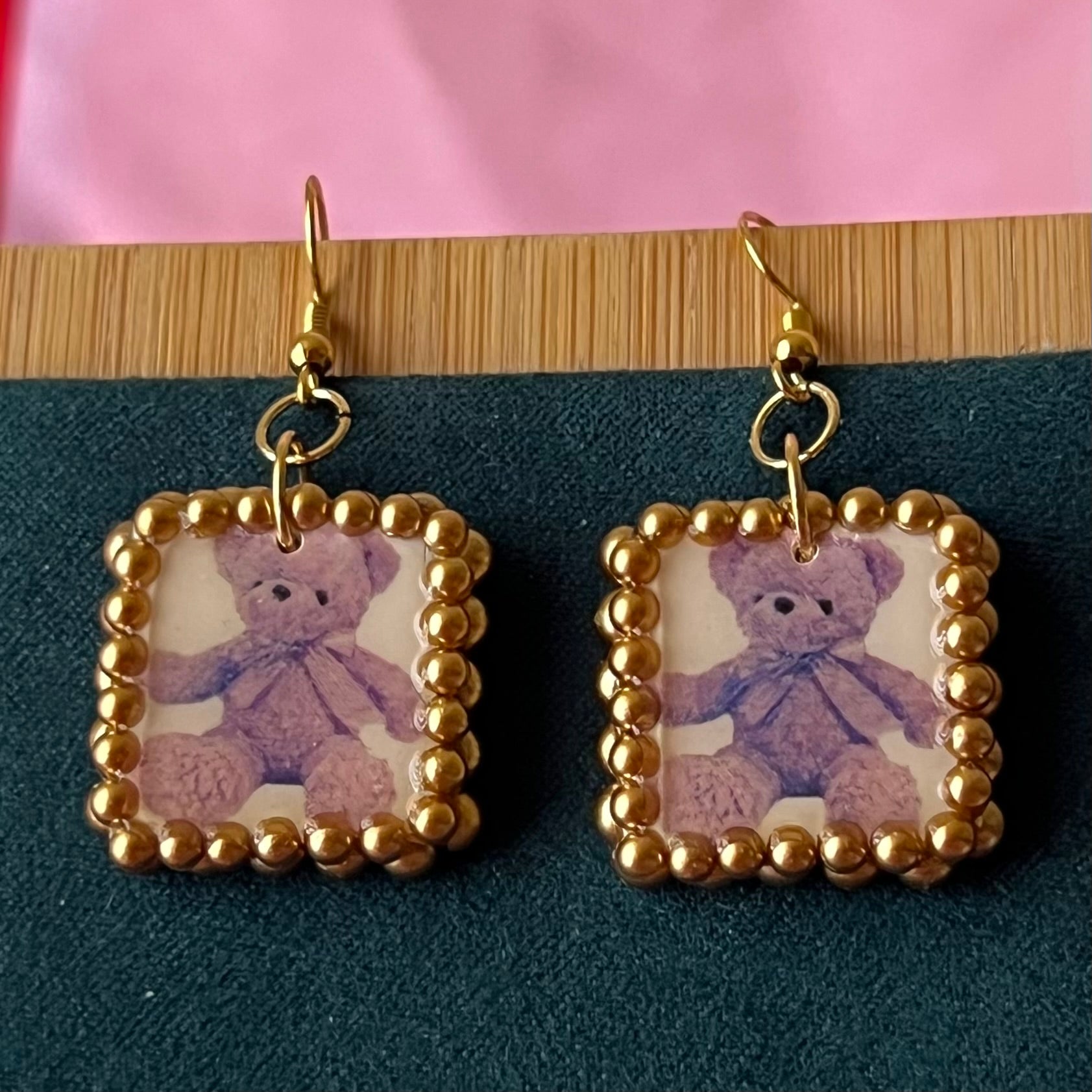 Gold pearl-framed teddy bear earrings, nostalgic toycore/coquette jewelry with a vintage plushie bear, 18k gold-plated hooks, handmade polymer clay charm, golden bronze faux pearls, kidcore style, statement ear dangles, collectible and gift‑ready.
