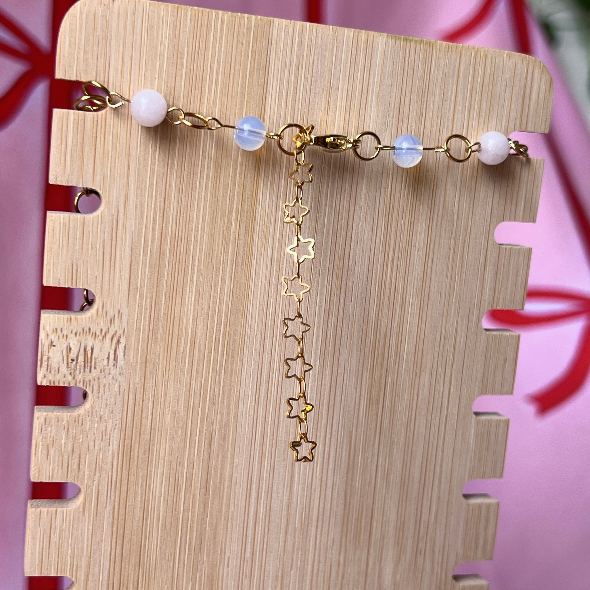 Gold plated dragon charm necklace — one-of-a-kind beaded necklace with rose quartz, opalite, and Indian agate plus handmade iridescent polymer clay dragon charm bedazzled with iridescent pearls, dark purple pearls, and rhinestones. 18k gold-plated links; 20" length + 2" star extender. Ready to ship.