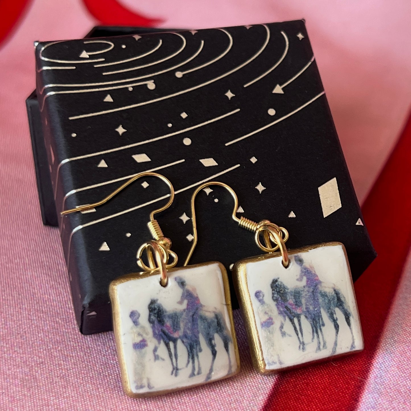 Antique aesthetic “Hindu Merchant” oil painting earrings inspired by Edwin Lord Weeks (c. 1885), featuring handmade polymer‑clay charms painted with metallic gold and gold‑plated hypoallergenic hooks—perfect for lovers of classical art, renaissance and vintage‑style jewelry.