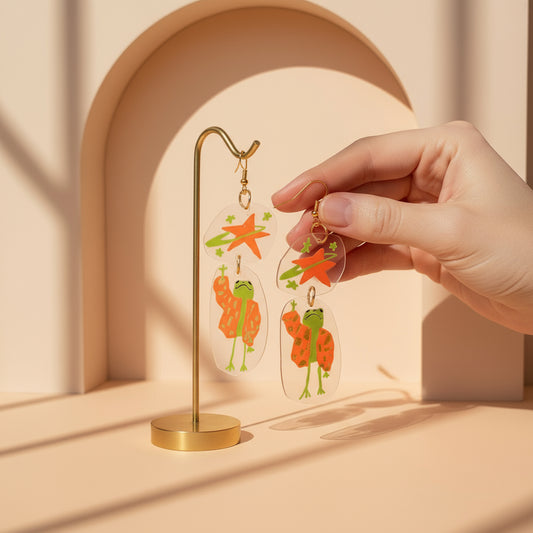 “Reaching for the Star" — Hand-Drawn Cosmic Puffer Frog Earrings