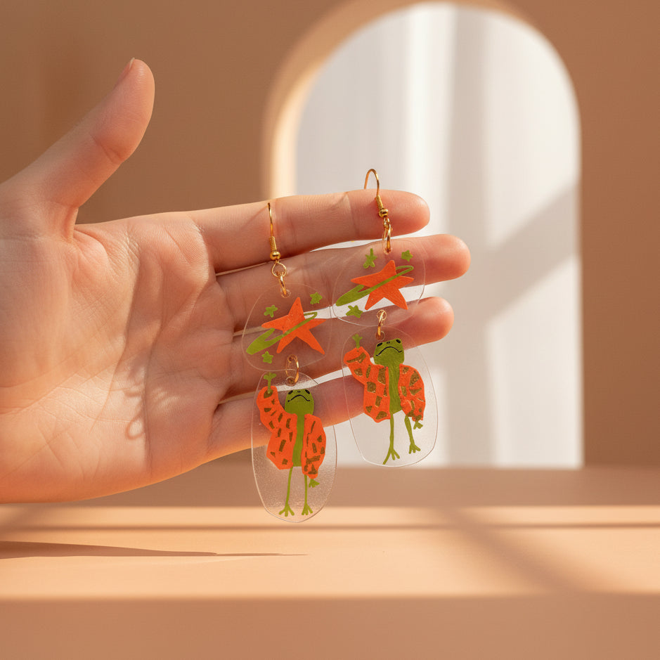 “Reaching for the Star" — Hand-Drawn Cosmic Puffer Frog Earrings