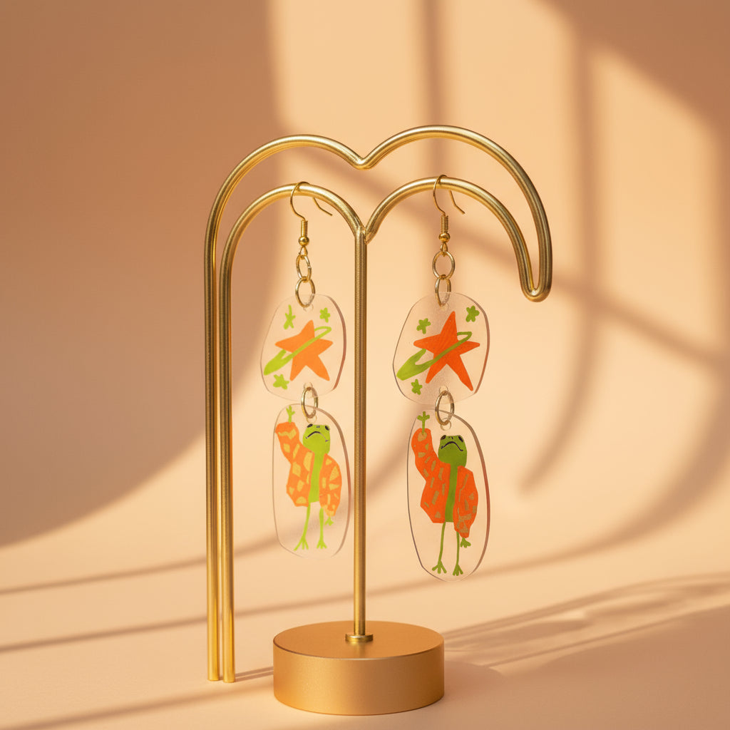 “Reaching for the Star" — Hand-Drawn Cosmic Puffer Frog Earrings