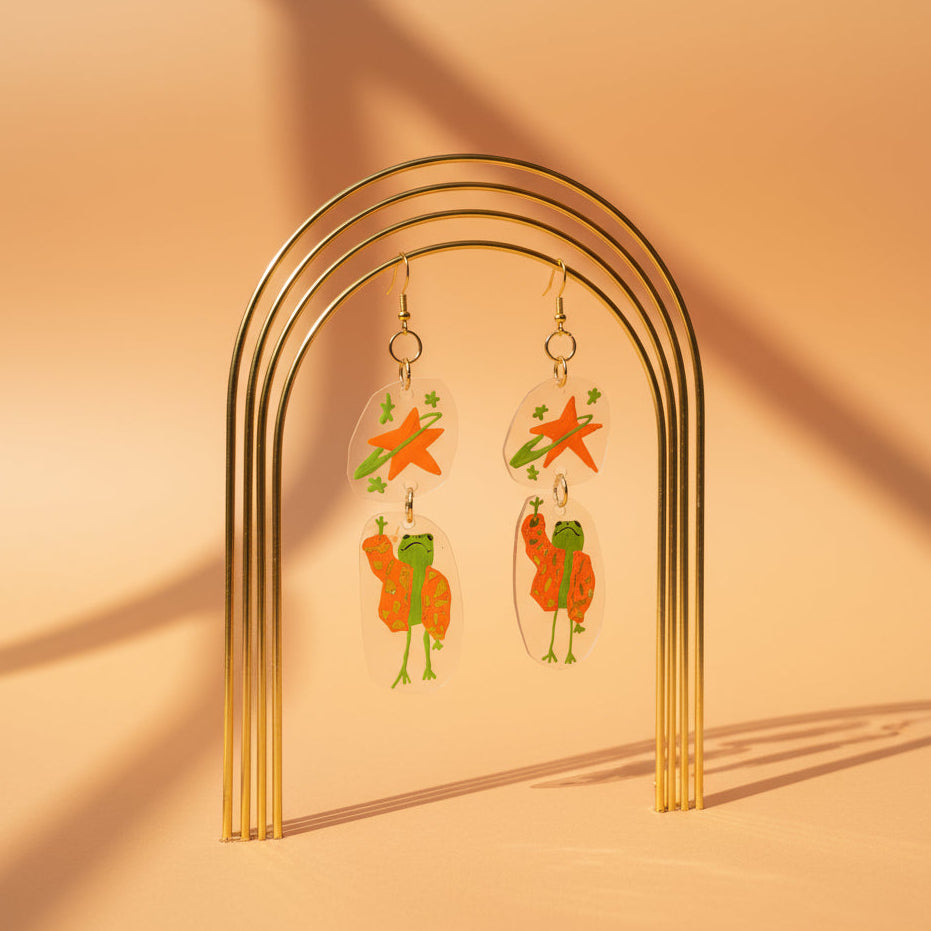 “Reaching for the Star" — Hand-Drawn Cosmic Puffer Frog Earrings