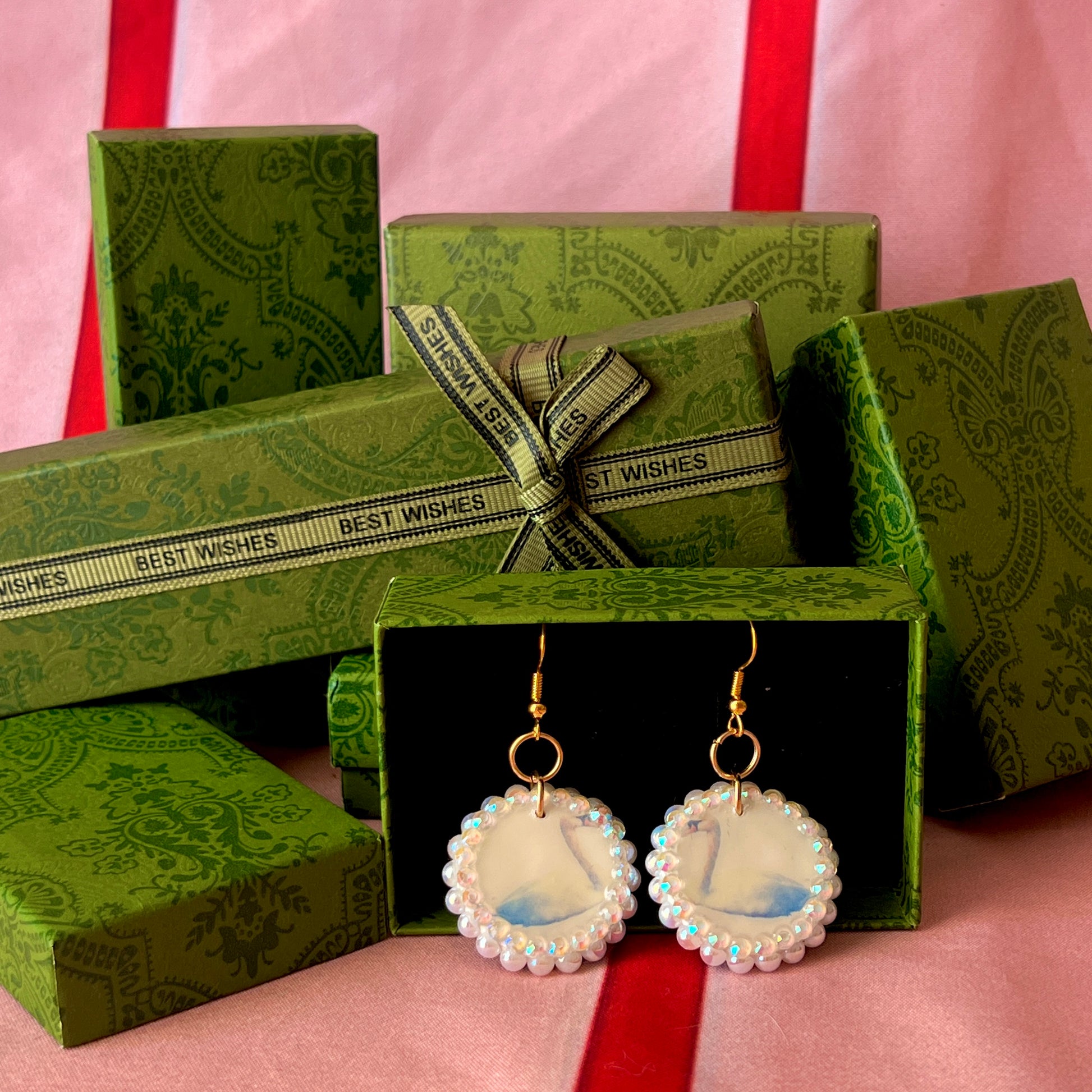 Alt text: “Iridescent swan charm earrings—handmade polymer clay swan dangle earrings bedazzled with iridescent beads, featuring 18k gold plated hypoallergenic hooks—perfect fairycore, coquette, cottagecore, whimsigoth, and Y2K style.”