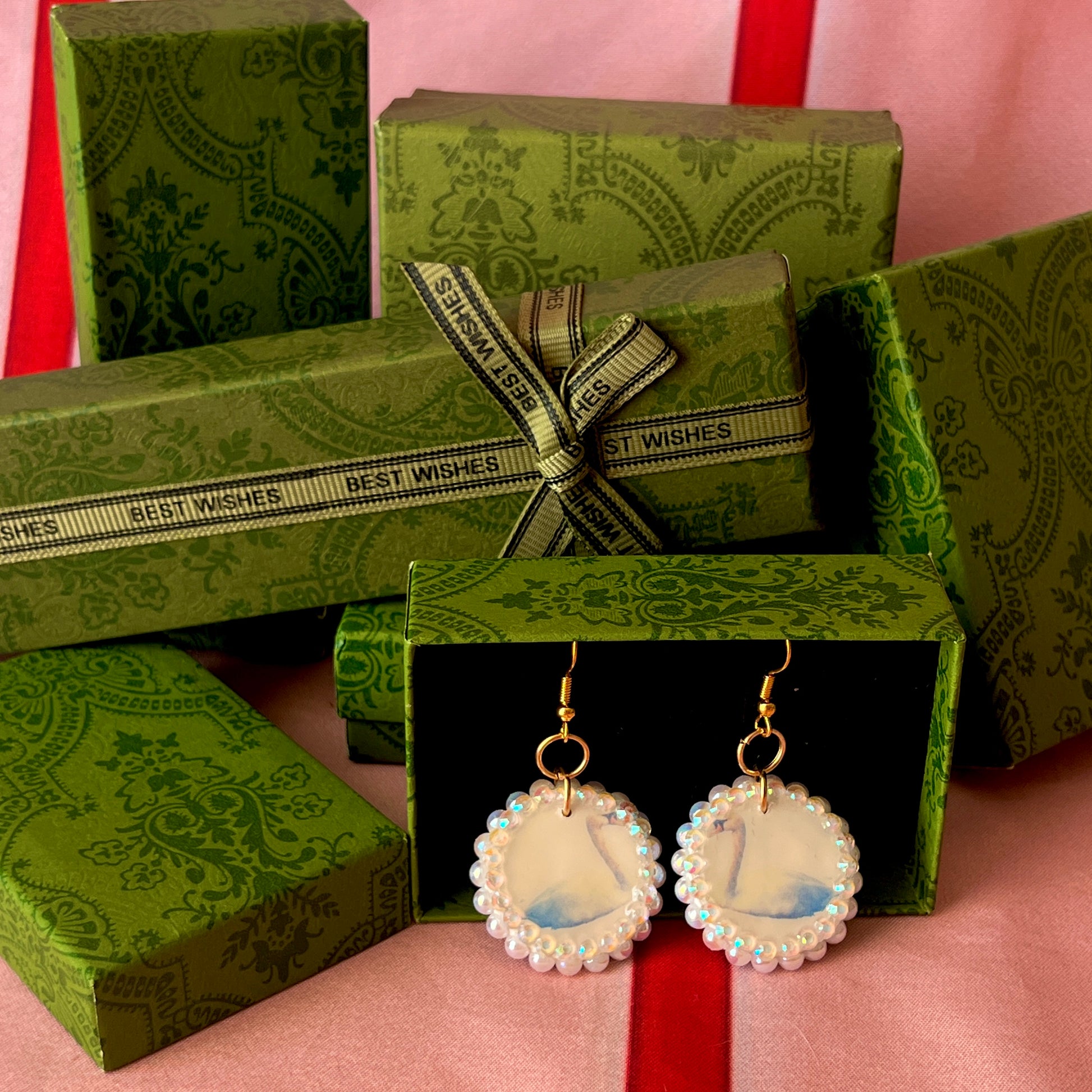 Alt text: “Iridescent swan charm earrings—handmade polymer clay swan dangle earrings bedazzled with iridescent beads, featuring 18k gold plated hypoallergenic hooks—perfect fairycore, coquette, cottagecore, whimsigoth, and Y2K style.”