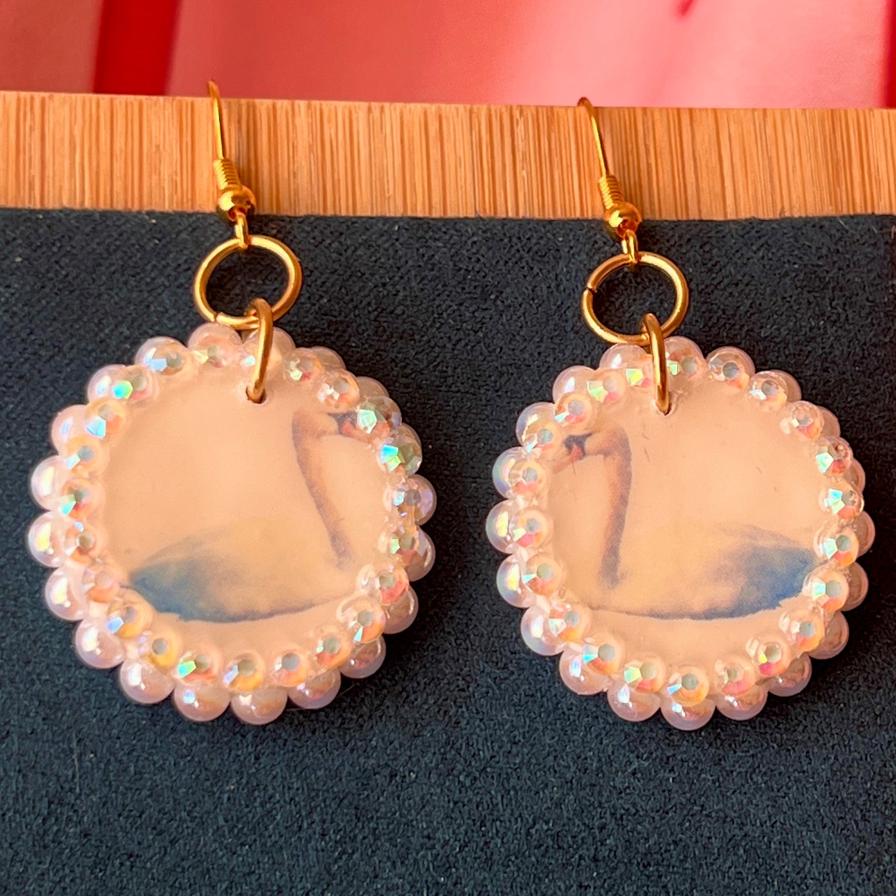 Alt text: “Iridescent swan charm earrings—handmade polymer clay swan dangle earrings bedazzled with iridescent beads, featuring 18k gold plated hypoallergenic hooks—perfect fairycore, coquette, cottagecore, whimsigoth, and Y2K style.”