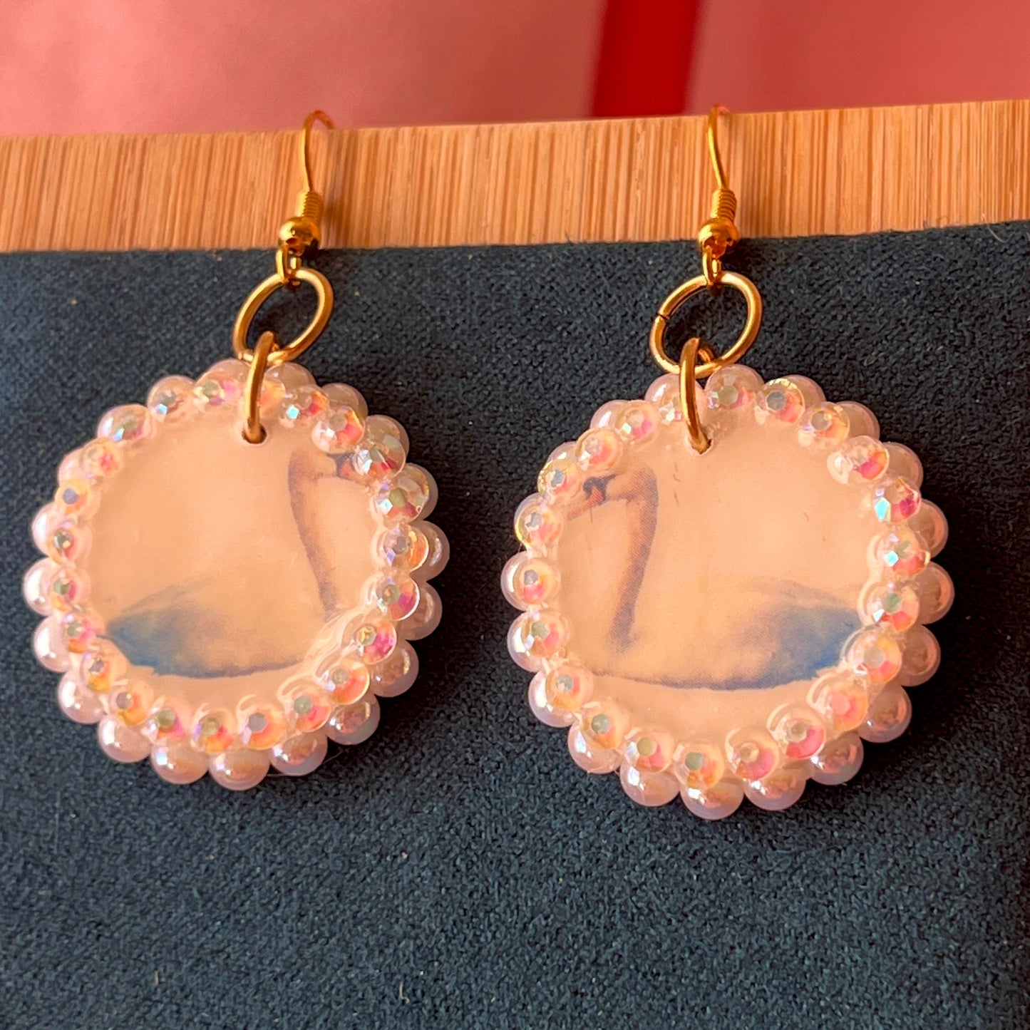 Alt text: “Iridescent swan charm earrings—handmade polymer clay swan dangle earrings bedazzled with iridescent beads, featuring 18k gold plated hypoallergenic hooks—perfect fairycore, coquette, cottagecore, whimsigoth, and Y2K style.”