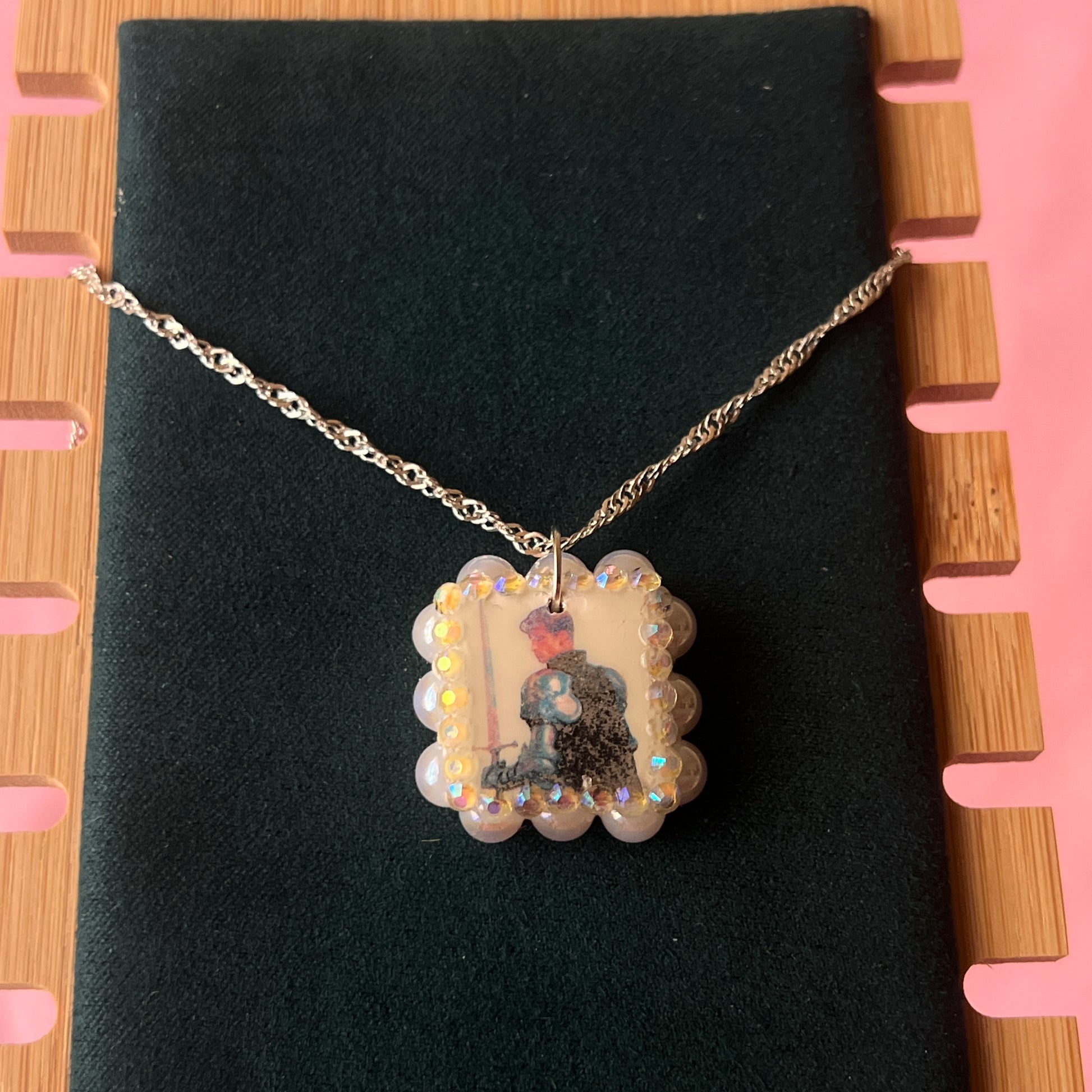 Iridescent knight & sword necklace — handmade polymer clay knight + sword charms bedazzled with iridescent beads on 20" 925 silver chain. Gift-ready green Victorian-patterned box. Fairycore coquette cottagecore Y2K charm necklace; ready to ship in 1–3 business days.