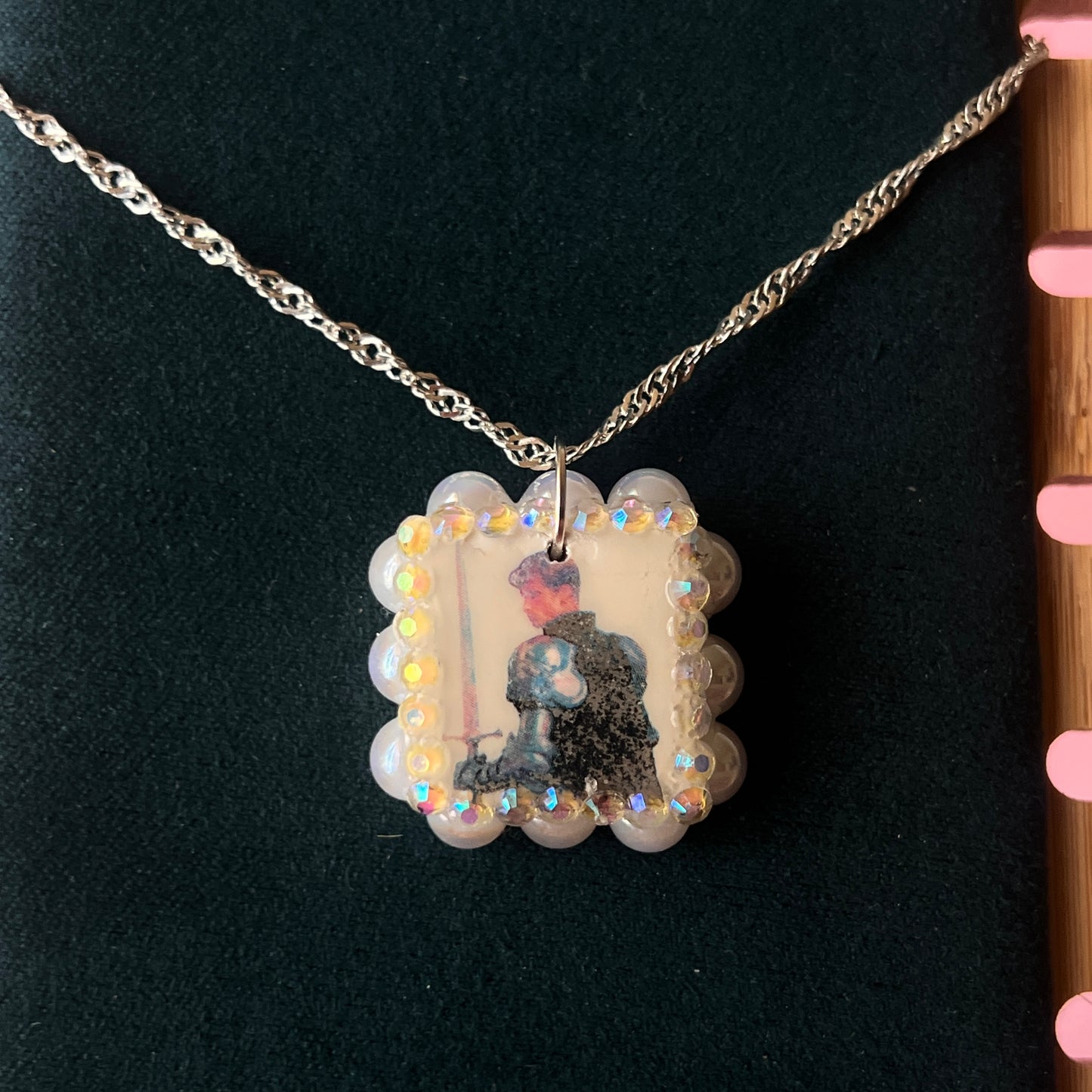 Iridescent knight & sword necklace — handmade polymer clay knight + sword charms bedazzled with iridescent beads on 20" 925 silver chain. Gift-ready green Victorian-patterned box. Fairycore coquette cottagecore Y2K charm necklace; ready to ship in 1–3 business days.