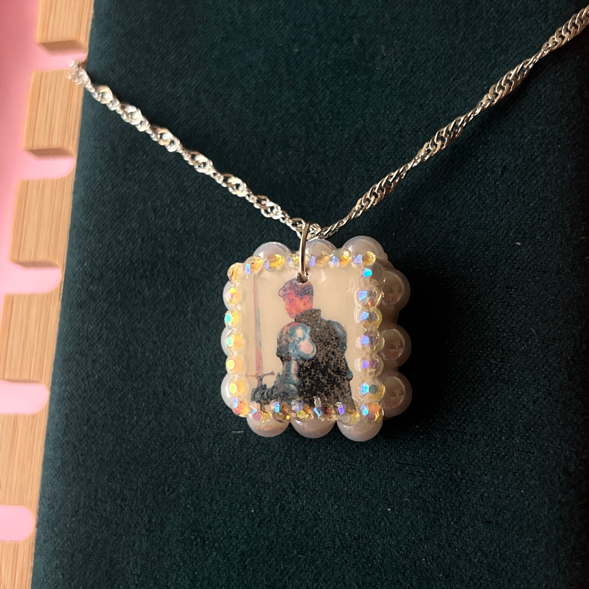 Iridescent knight & sword necklace — handmade polymer clay knight + sword charms bedazzled with iridescent beads on 20" 925 silver chain. Gift-ready green Victorian-patterned box. Fairycore coquette cottagecore Y2K charm necklace; ready to ship in 1–3 business days.