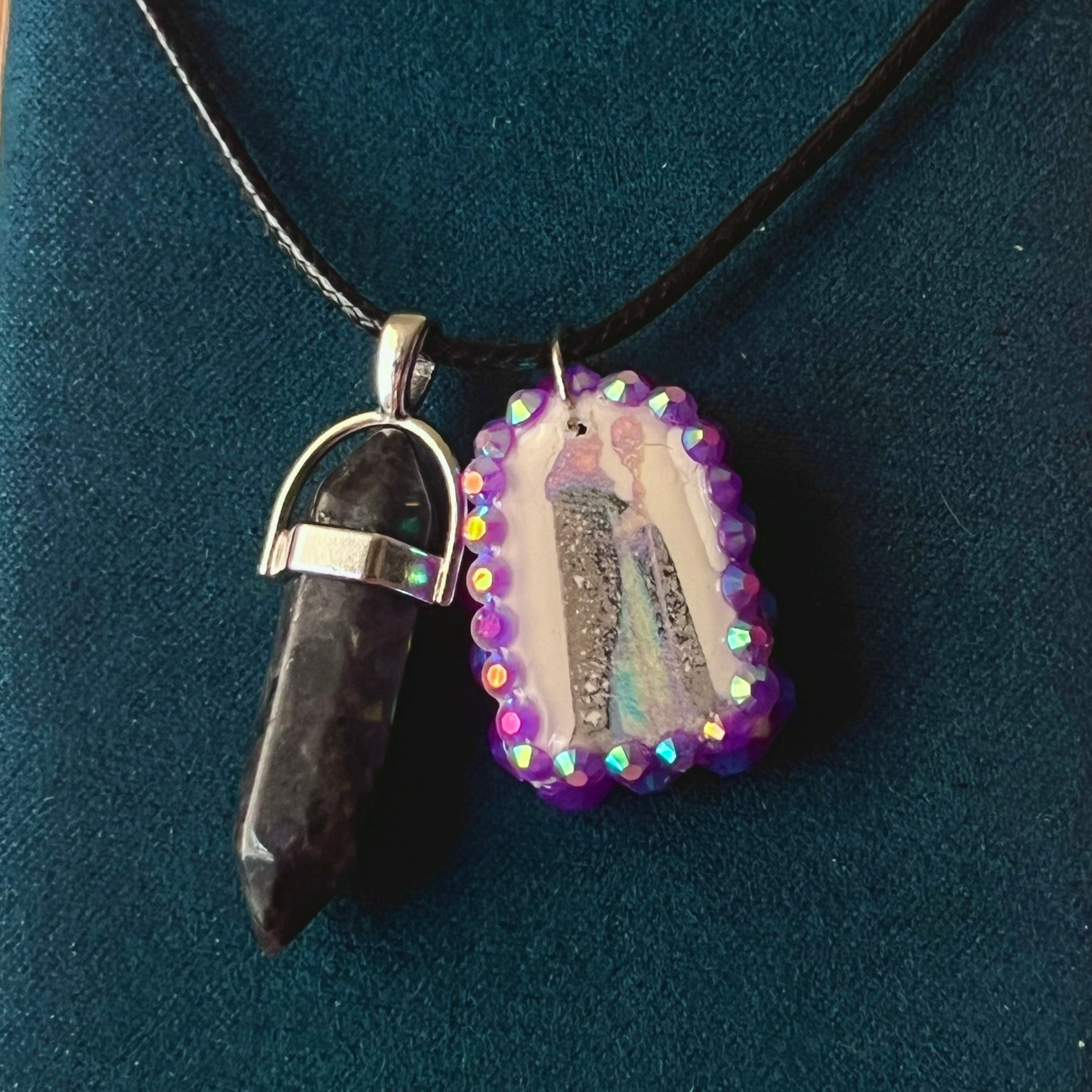Medieval sorceress polymer charm necklace — black vegan leather chain with black marbled stone pendant plus arched sorceress charm (approx. 1" x 0.75") featuring staff + glowing orb, bedazzled with purple iridescent pearls. Dark medievalcore / fantasy talisman jewelry; ready to ship.