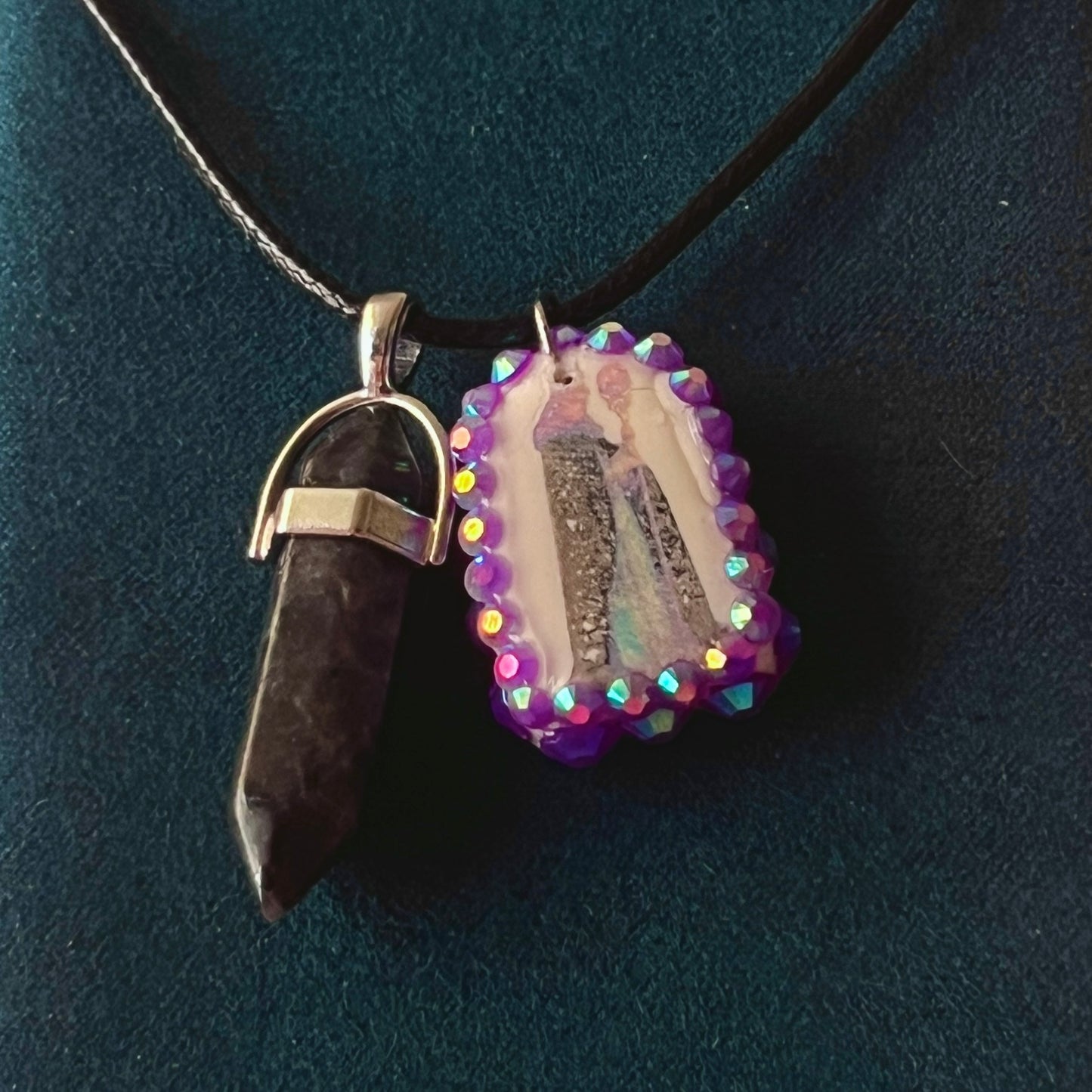 Medieval sorceress polymer charm necklace — black vegan leather chain with black marbled stone pendant plus arched sorceress charm (approx. 1" x 0.75") featuring staff + glowing orb, bedazzled with purple iridescent pearls. Dark medievalcore / fantasy talisman jewelry; ready to ship.