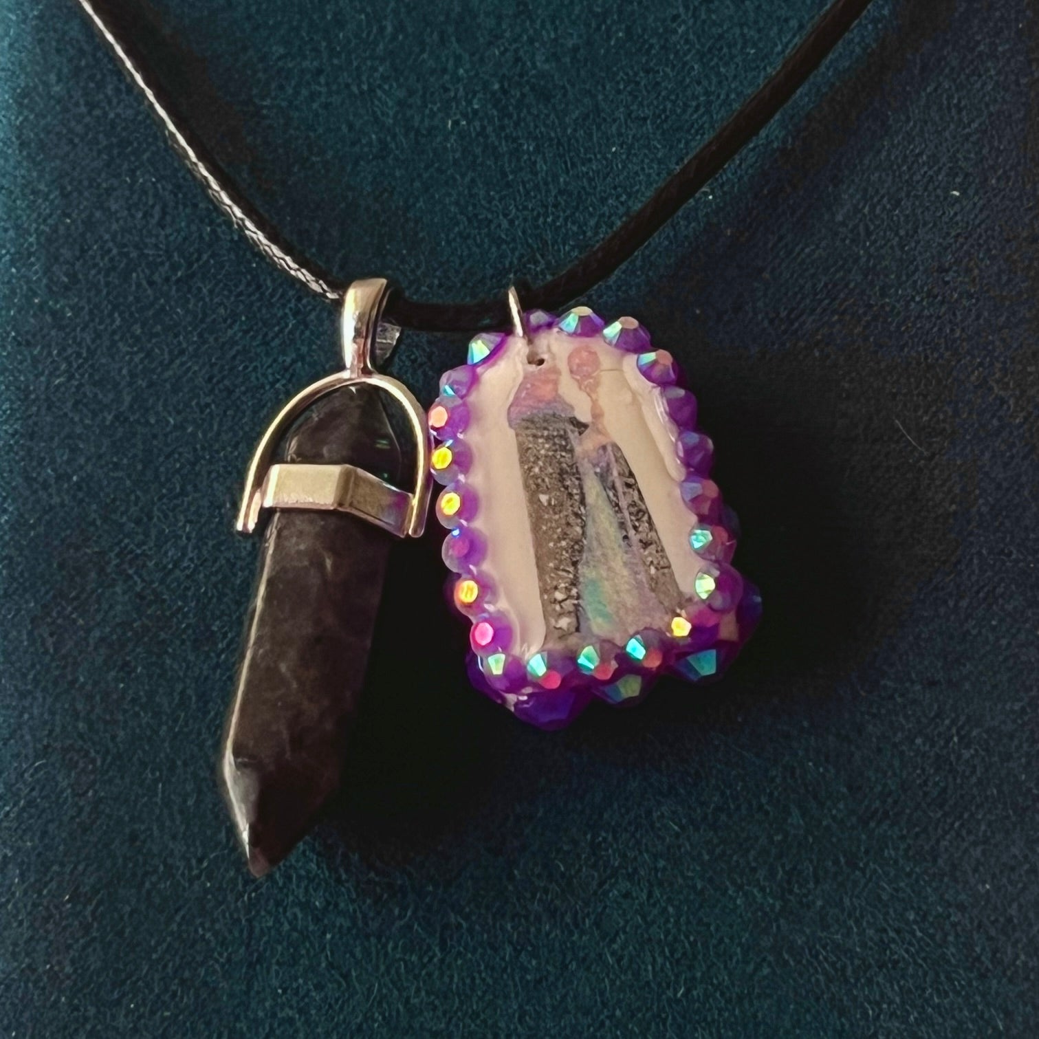 Medieval sorceress polymer charm necklace — black vegan leather chain with black marbled stone pendant plus arched sorceress charm (approx. 1" x 0.75") featuring staff + glowing orb, bedazzled with purple iridescent pearls. Dark medievalcore / fantasy talisman jewelry; ready to ship.