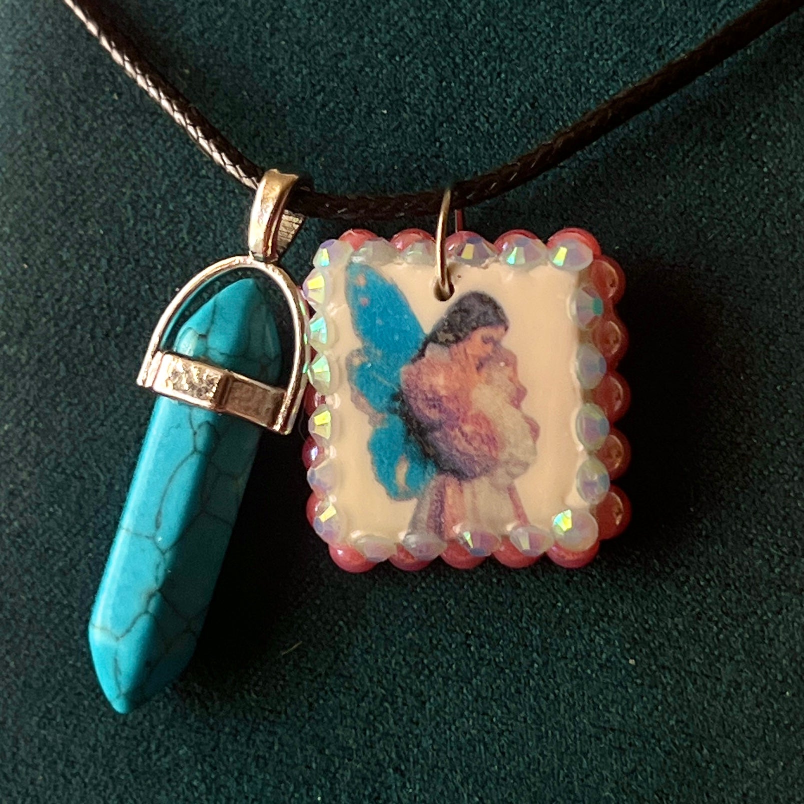 Pink + blue fairy charm necklace — handmade polymer clay fairy pendant framed with iridescent pearls, finished with bright blue gem drop on 22" vegan leather chain with 1.5" extender for adjustable fit. Soft fairycore talisman jewelry. Ready to ship.