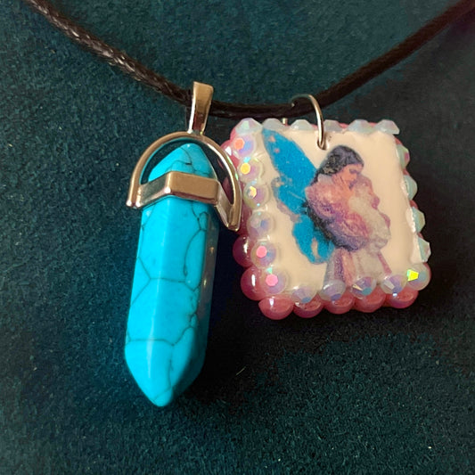 Pink + blue fairy charm necklace — handmade polymer clay fairy pendant framed with iridescent pearls, finished with bright blue gem drop on 22" vegan leather chain with 1.5" extender for adjustable fit. Soft fairycore talisman jewelry. Ready to ship.