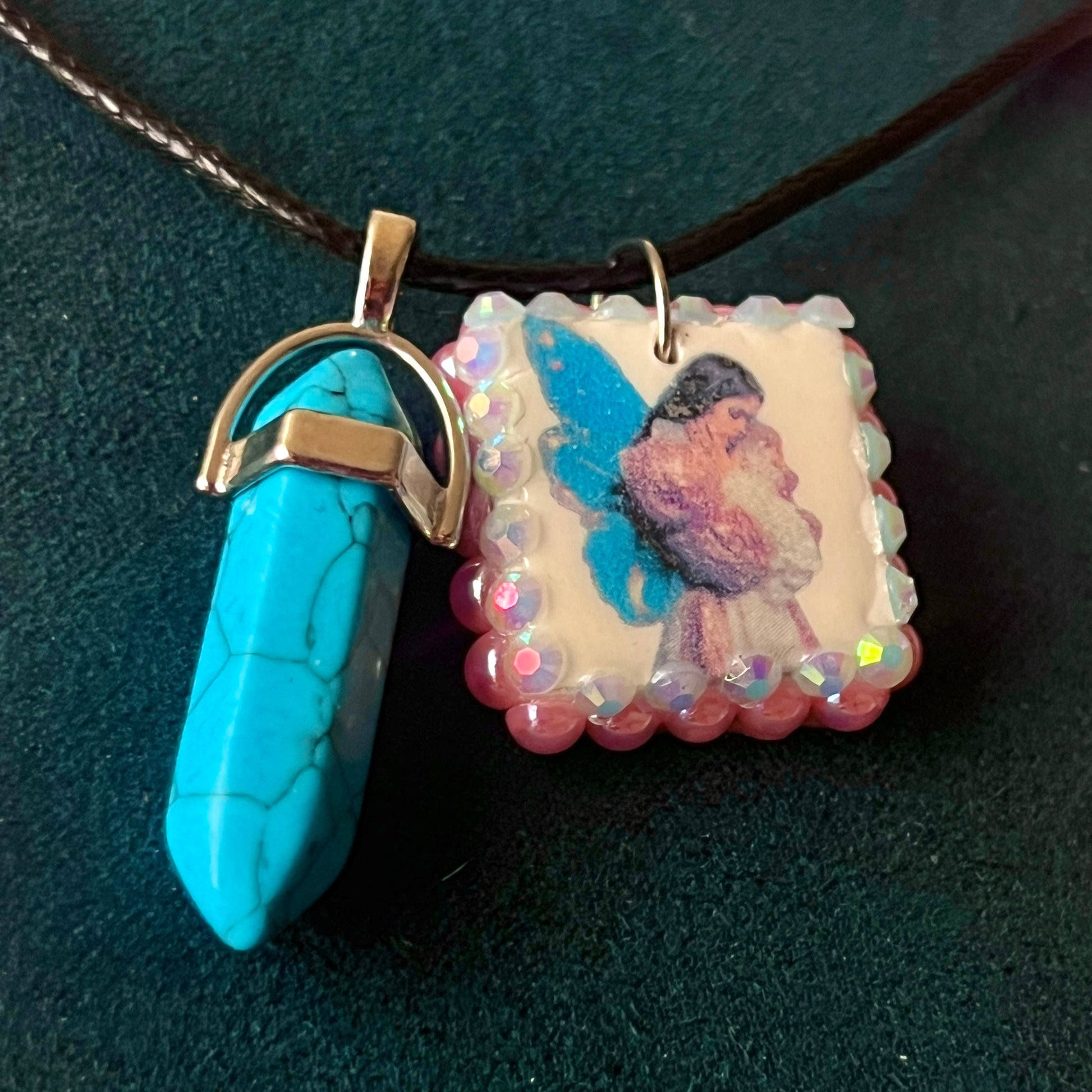 Pink + blue fairy charm necklace — handmade polymer clay fairy pendant framed with iridescent pearls, finished with bright blue gem drop on 22" vegan leather chain with 1.5" extender for adjustable fit. Soft fairycore talisman jewelry. Ready to ship.