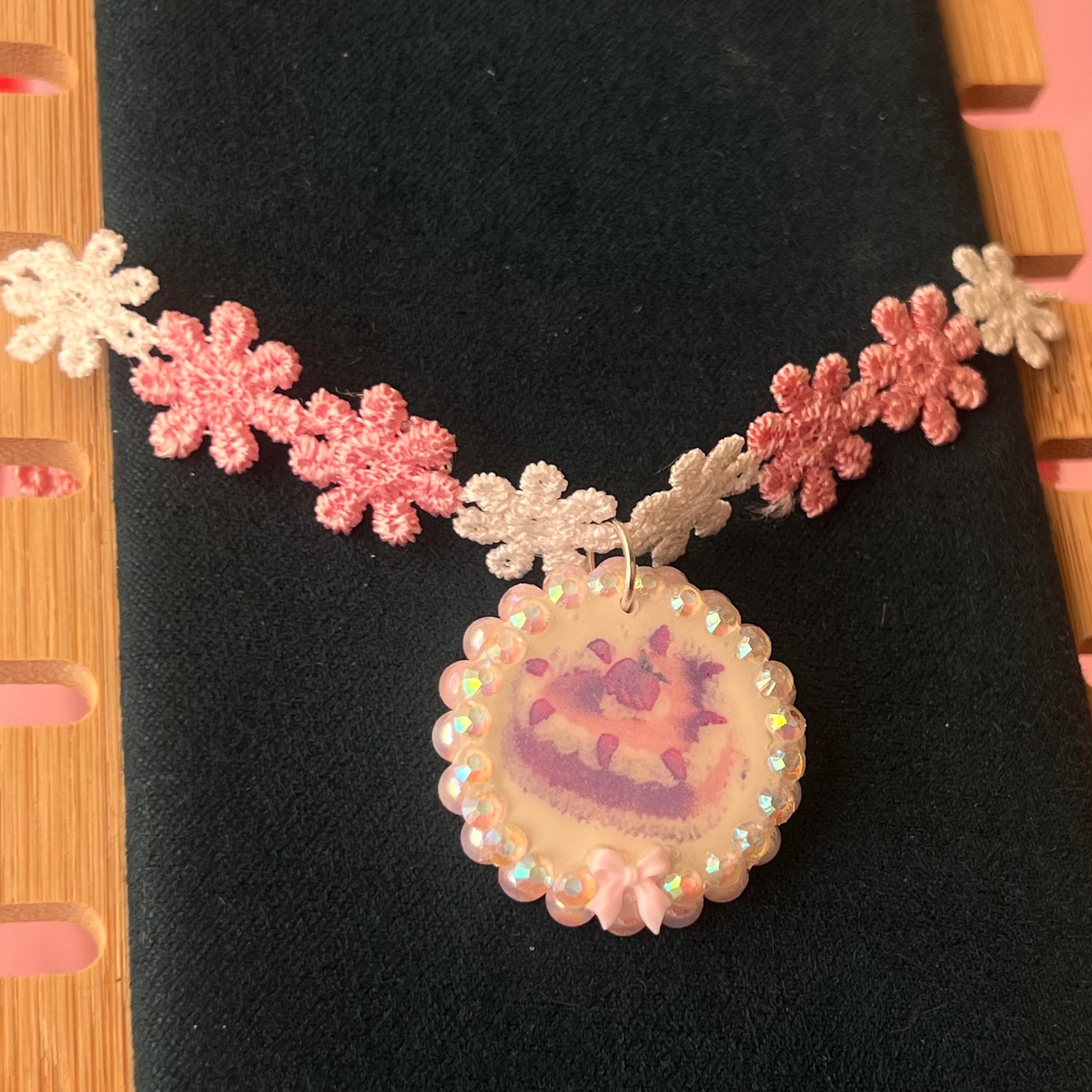 Handcrafted polymer‑clay strawberry cake flower choker in pink lace, featuring iridescent pearls, rhinestones, and a cute coquette kawaii design—perfect sweet‑lolita, pastel, y2k aesthetic jewelry.
