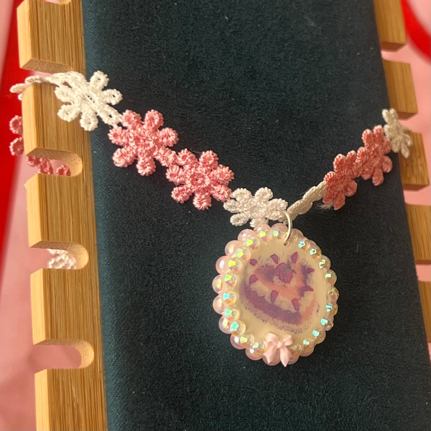 Handcrafted polymer‑clay strawberry cake flower choker in pink lace, featuring iridescent pearls, rhinestones, and a cute coquette kawaii design—perfect sweet‑lolita, pastel, y2k aesthetic jewelry.