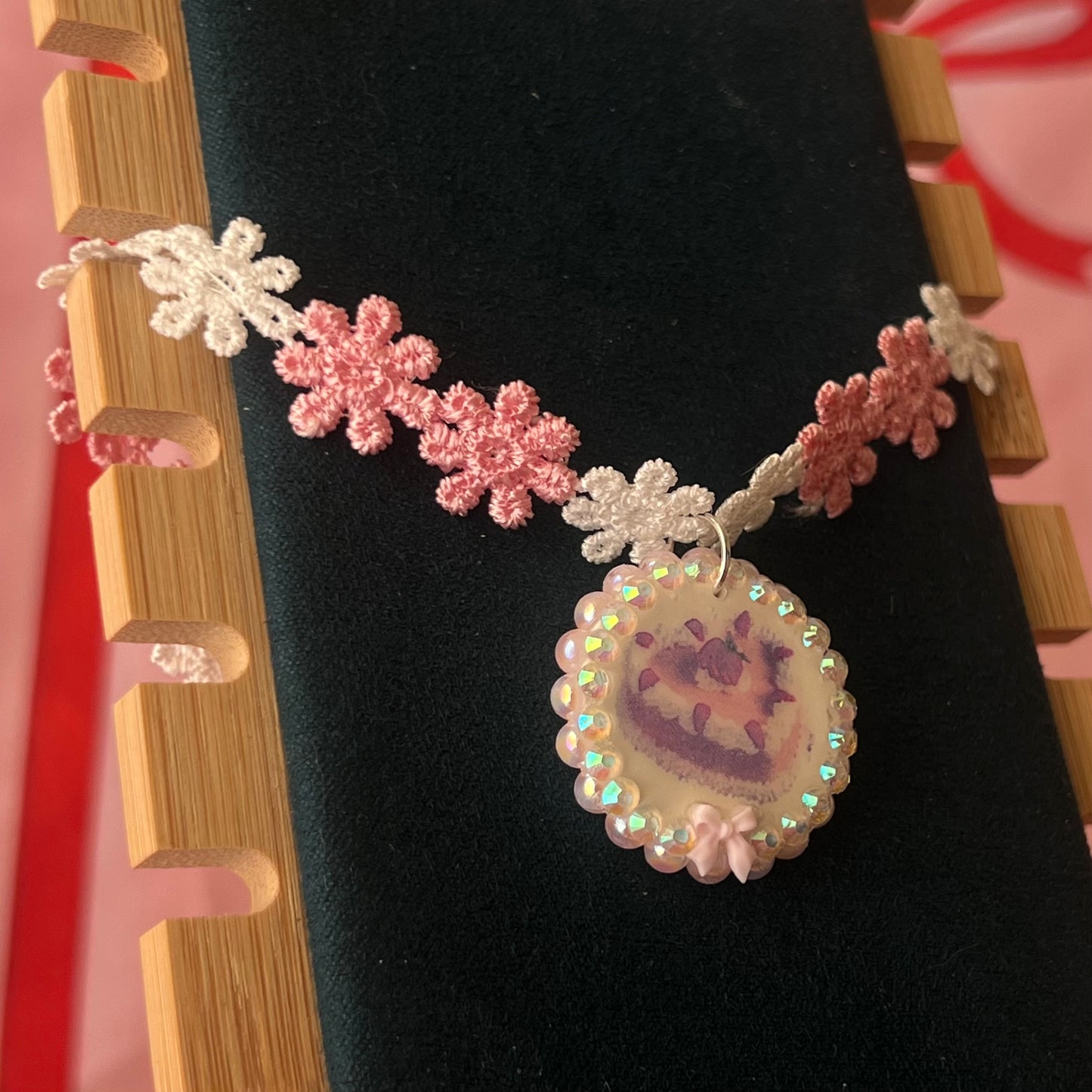 Handcrafted polymer‑clay strawberry cake flower choker in pink lace, featuring iridescent pearls, rhinestones, and a cute coquette kawaii design—perfect sweet‑lolita, pastel, y2k aesthetic jewelry.
