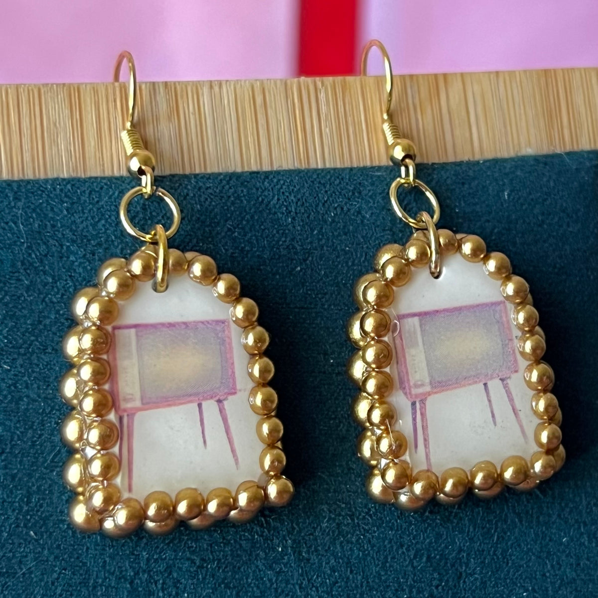 Handmade retro vintage TV charm earrings — pearl‑bedazzled arch dangles with a nostalgic TV graphic, gold/bronze pearl framing and 18k gold‑plated hooks; perfect retro, vintage, Y2K, indie, polymer‑clay statement jewelry.
