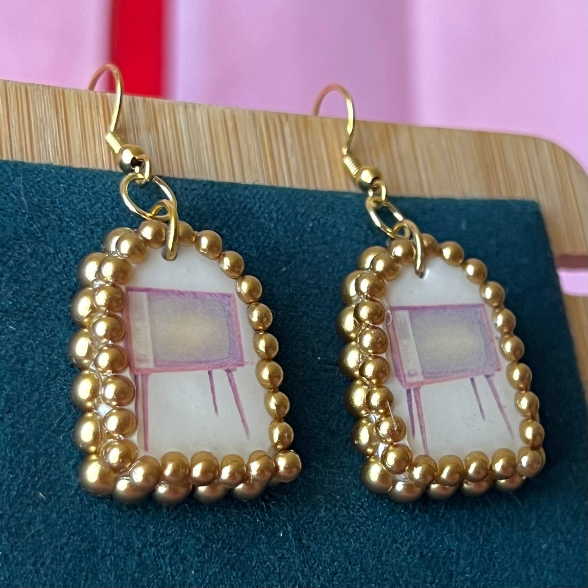 Handmade retro vintage TV charm earrings — pearl‑bedazzled arch dangles with a nostalgic TV graphic, gold/bronze pearl framing and 18k gold‑plated hooks; perfect retro, vintage, Y2K, indie, polymer‑clay statement jewelry.