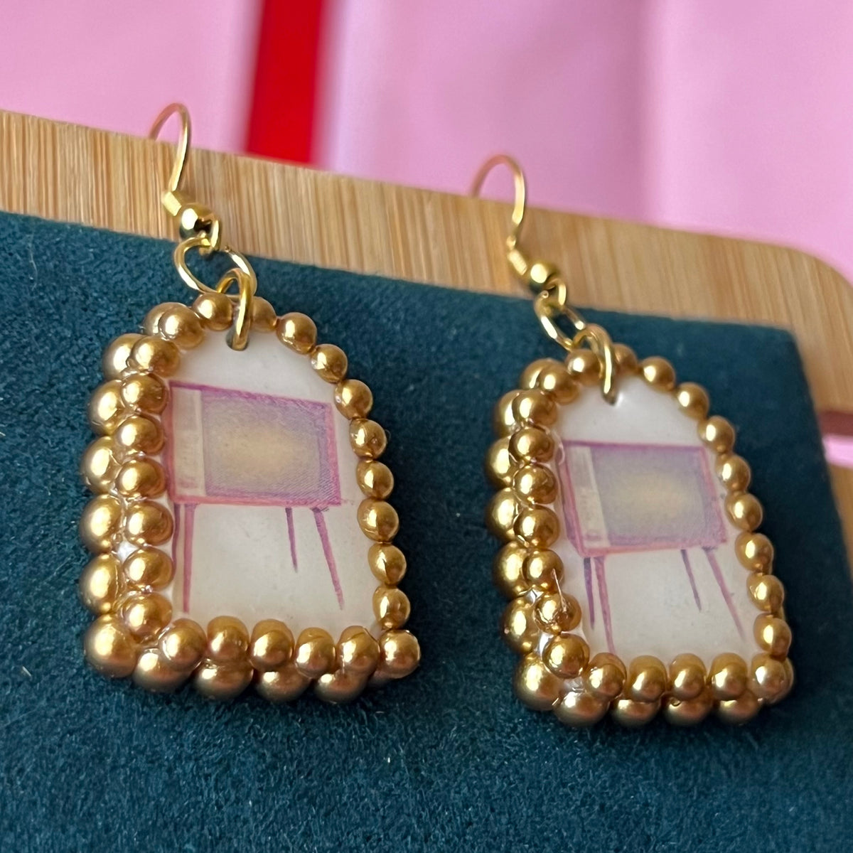 Handmade retro vintage TV charm earrings — pearl‑bedazzled arch dangles with a nostalgic TV graphic, gold/bronze pearl framing and 18k gold‑plated hooks; perfect retro, vintage, Y2K, indie, polymer‑clay statement jewelry.