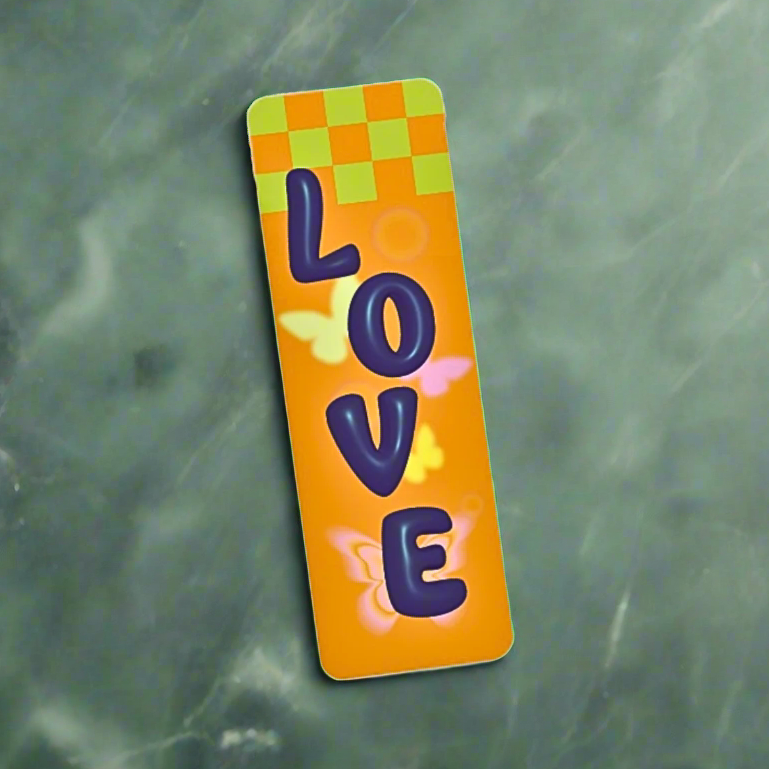 Neon orange Y2k kidcore sticker collage bookmark with colorful 'LOVE' stickers on a green surface background with leaves