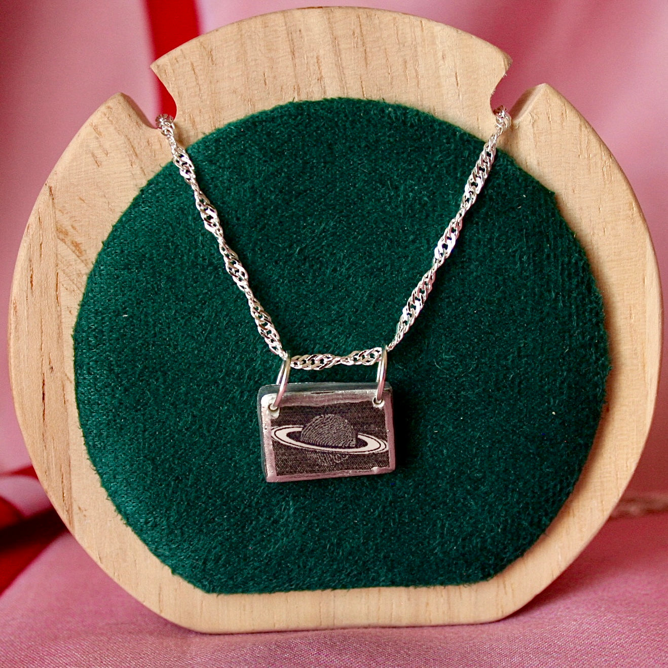 Saturn’s Rings necklace — handmade black & white rectangular polymer clay Saturn charm with metallic silver-black paint on 20" 925 sterling silver chain. Minimal cosmic astrology space jewelry; gift-ready black celestial box. Ready to ship in 1–3 days.