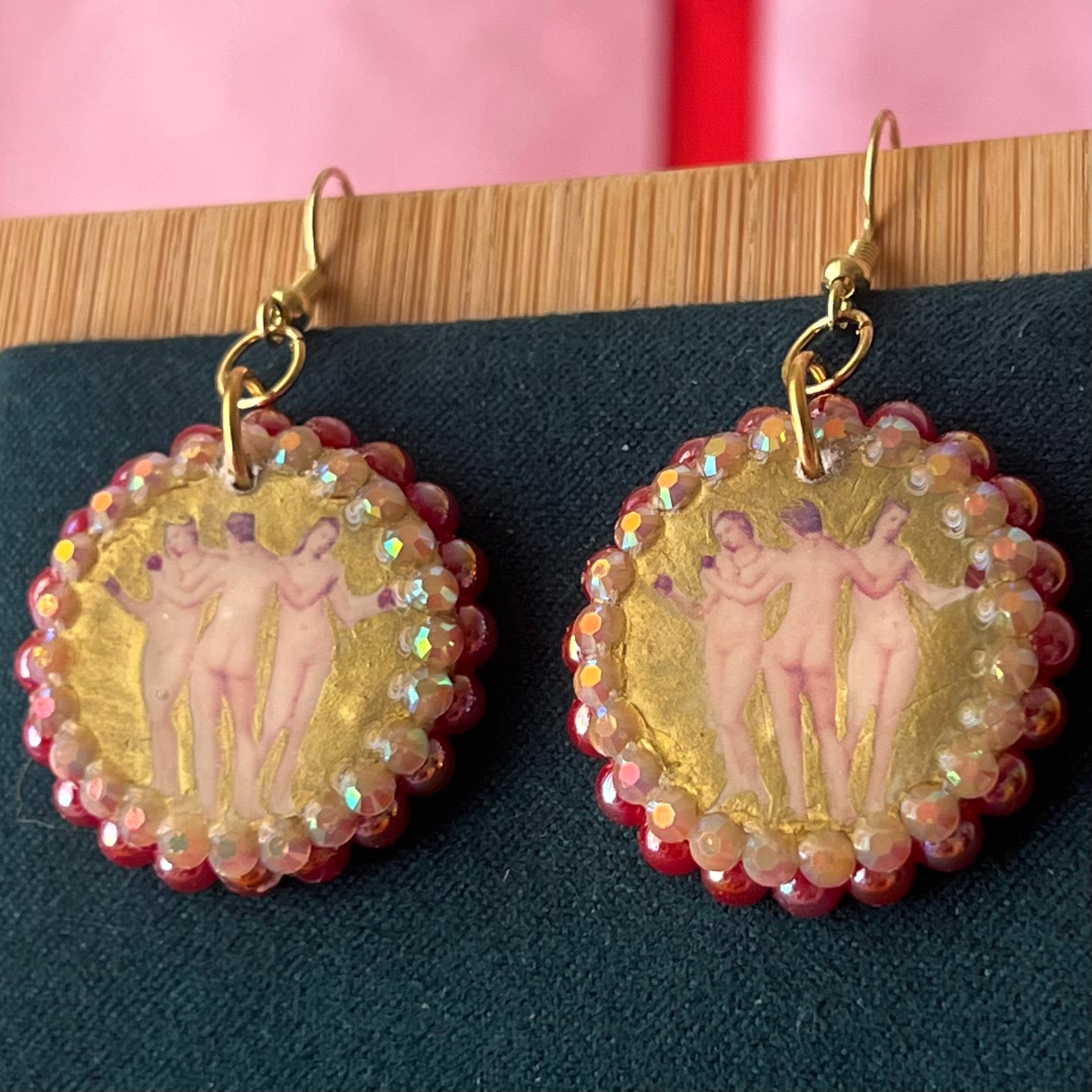Handmade Three Graces gold earrings: metallic gold‑painted polymer clay framed with iridescent pearls and rhinestones, featuring hypoallergenic 18k gold‑plated hooks—perfect fairy‑core, goddess‑core, statement piece for lovers of Greek mythology jewelry.