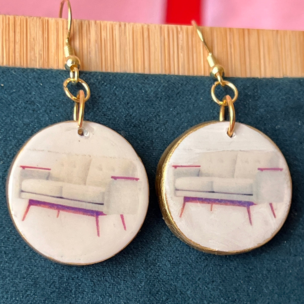 Handmade white couch earrings—polymer‑clay mini sofa charms painted with metallic gold, featuring gold‑plated hypoallergenic hooks; perfect retro Y2K dreamcore jewelry for quirky, miniature‑object lovers.