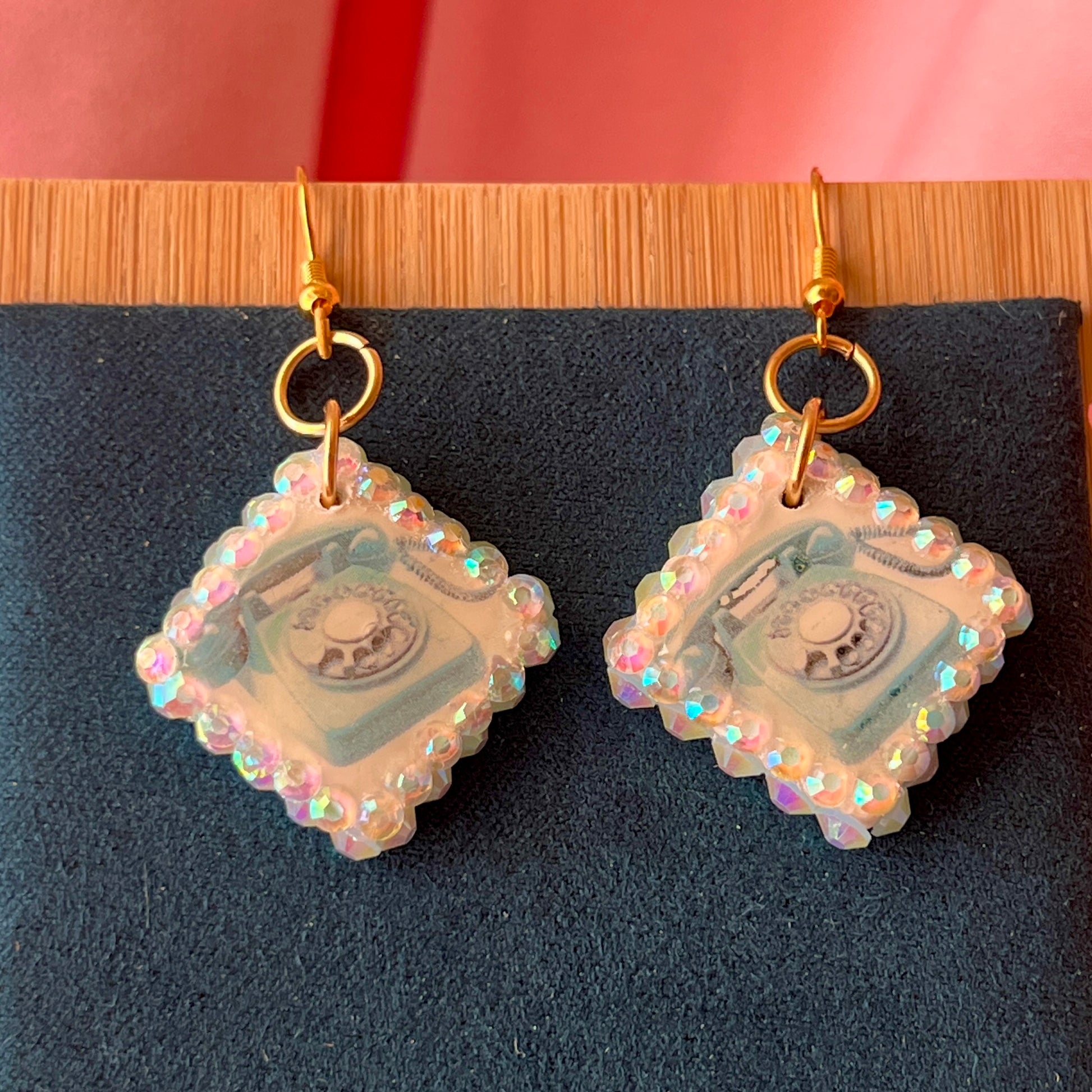 Alt text: "Whimsical Y2K retro landline phone earrings with metallic gold backing, 18k gold‑plated brass hooks, and a playful phone design – perfect statement earrings for Y2K, whimsigoth, and retro aesthetic jewelry."