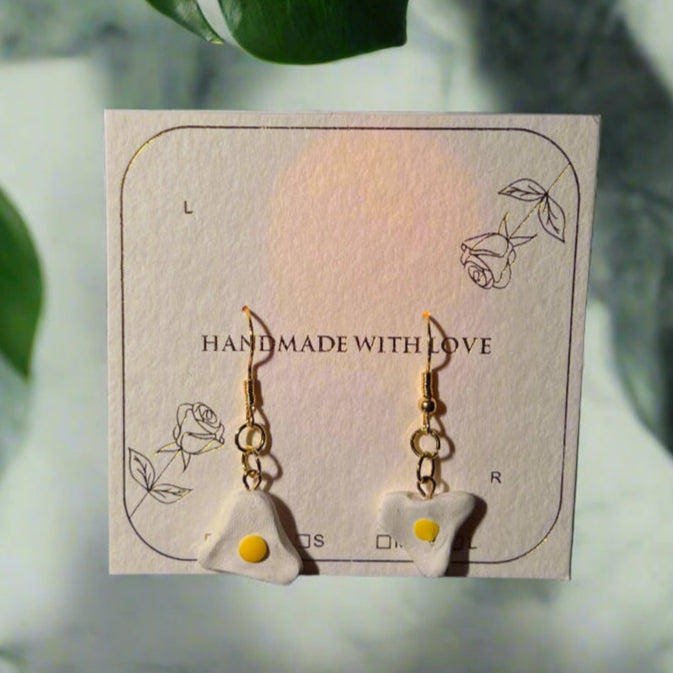 Earring card with earrings on a dark background