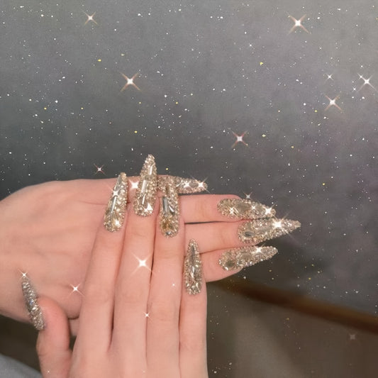 gold rhinestone nail adornment