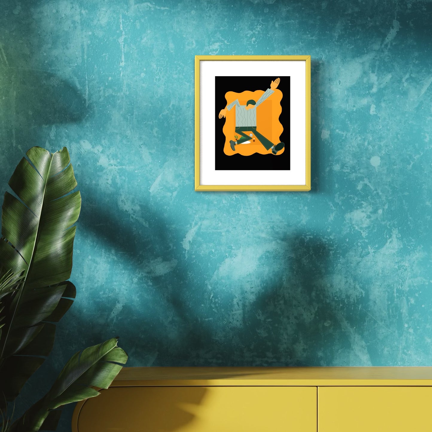 Framed artwork on a textured teal wall with a yellow cabinet and plant.