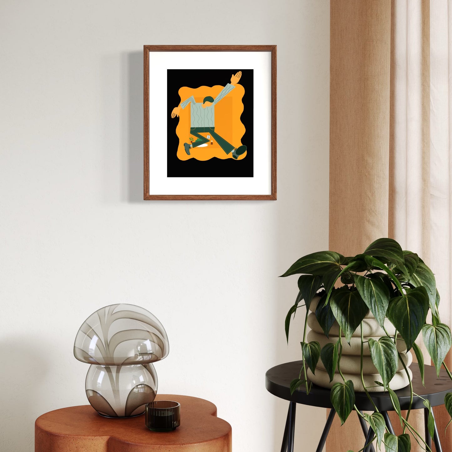 Framed abstract artwork on a wall with decorative items below