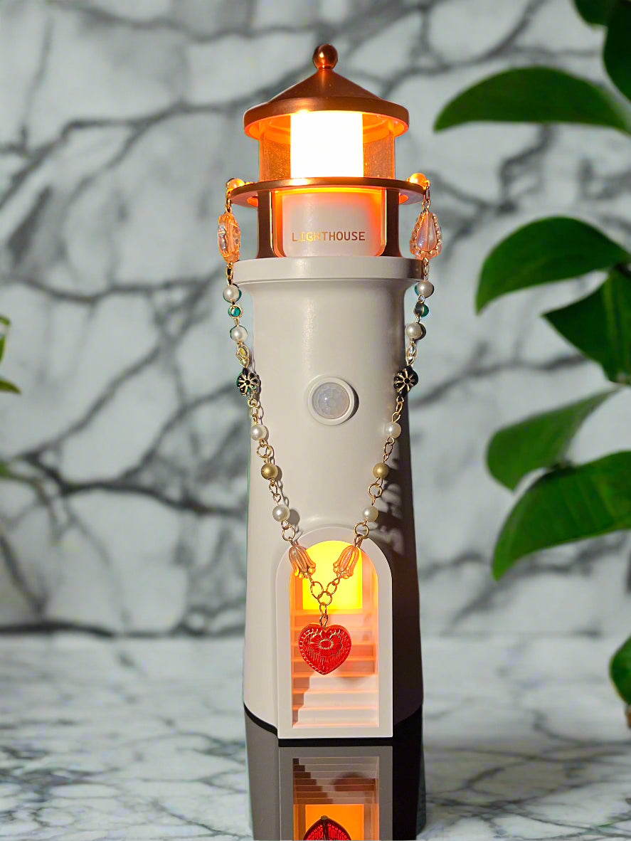 Decorative lamp with a chain and small object on a reflective surface