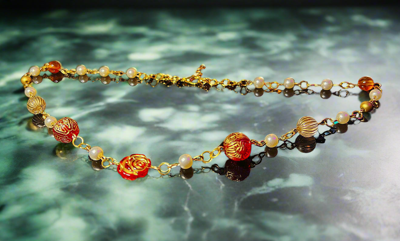 Necklace with colorful beads on a reflective surface