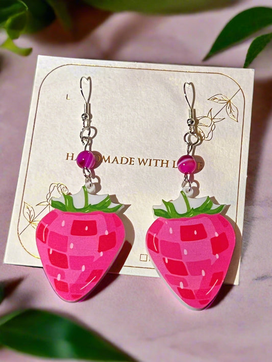 Strawberry-shaped earrings on a card with 'Handmade with Love' text.