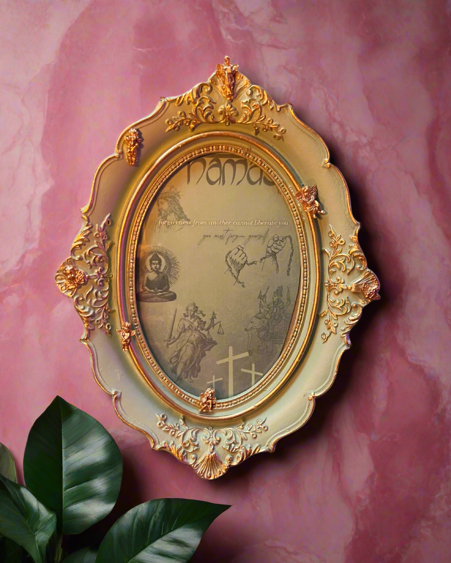 Decorative gold frame with intricate designs on a pink background