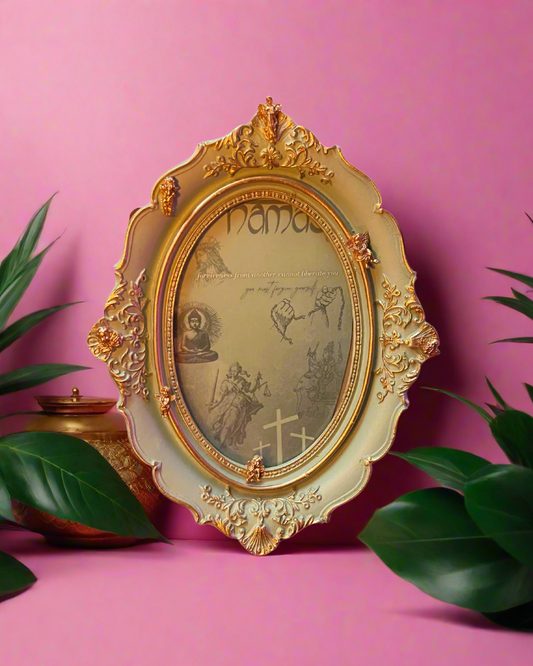 Decorative gold frame with intricate designs on a pink background
