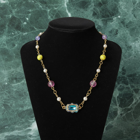 Necklace with colorful beads on a dark surface