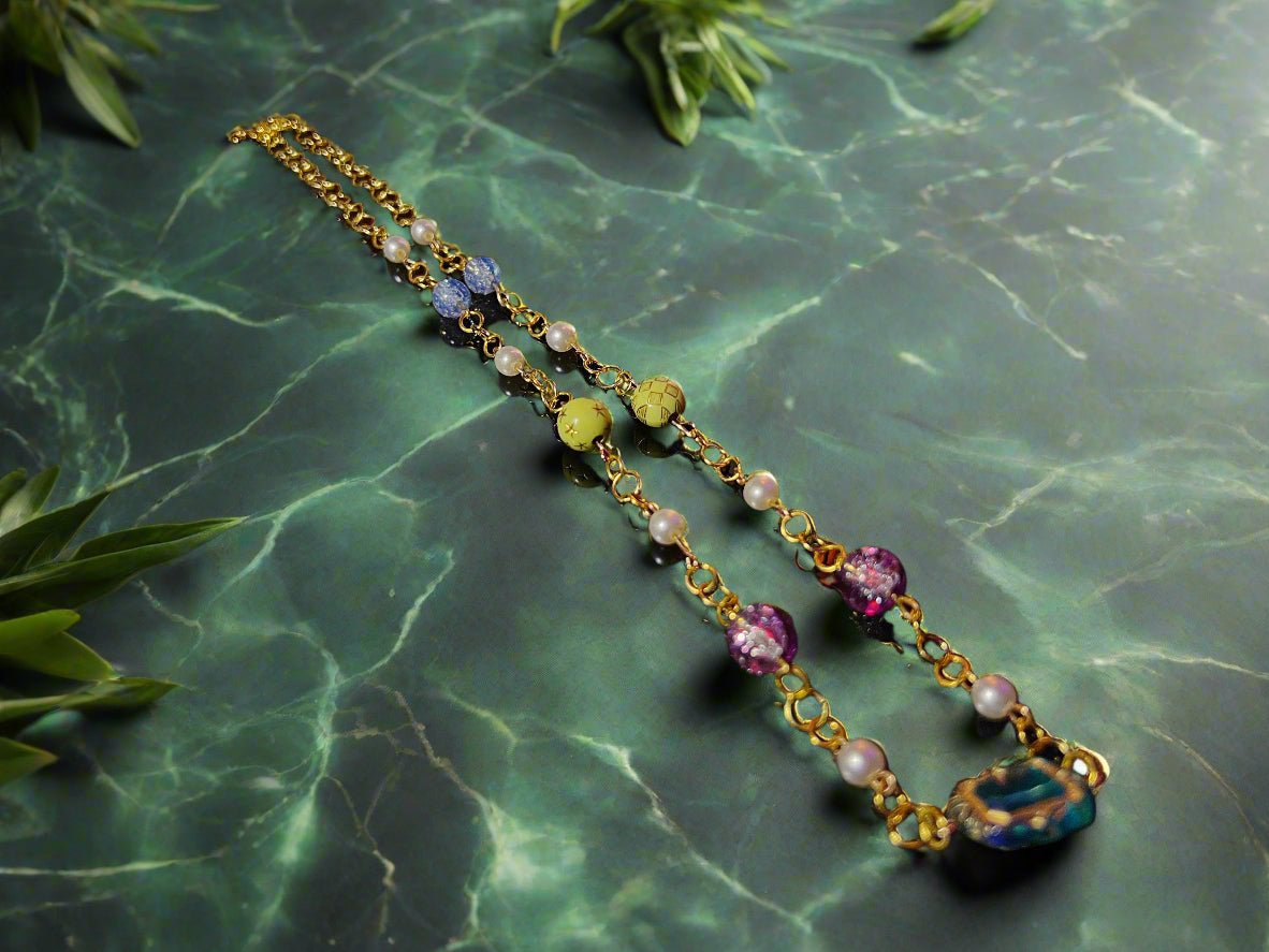 Necklace with colorful beads on a dark surface